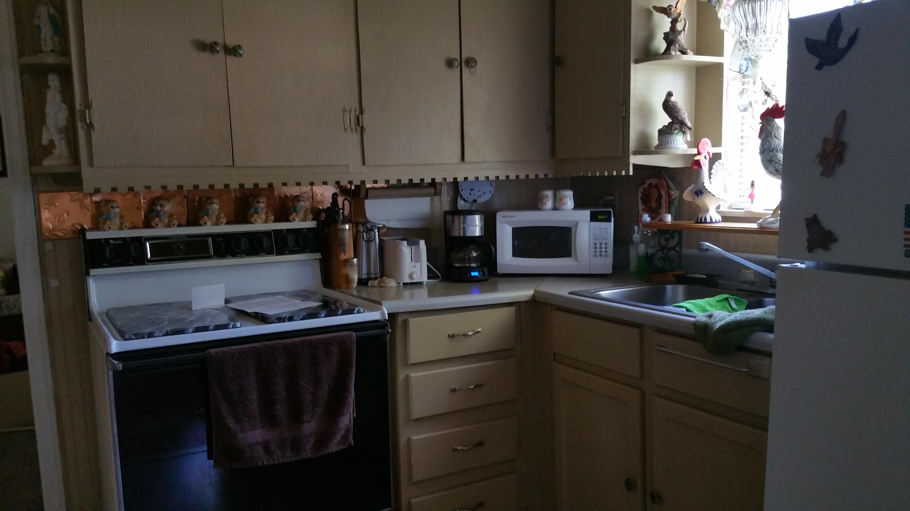 2079 Morgans Mill Road Goodview, VA 24095 - Photo 3 of 9 a kitchen with stainless steel appliances granite countertop a stove a sink and a microwave