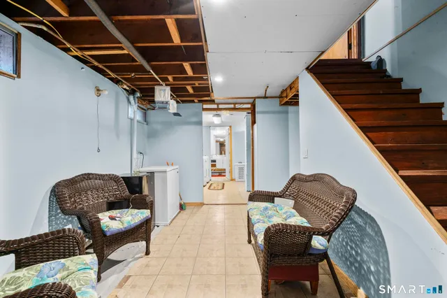 a bedroom with bed and a window