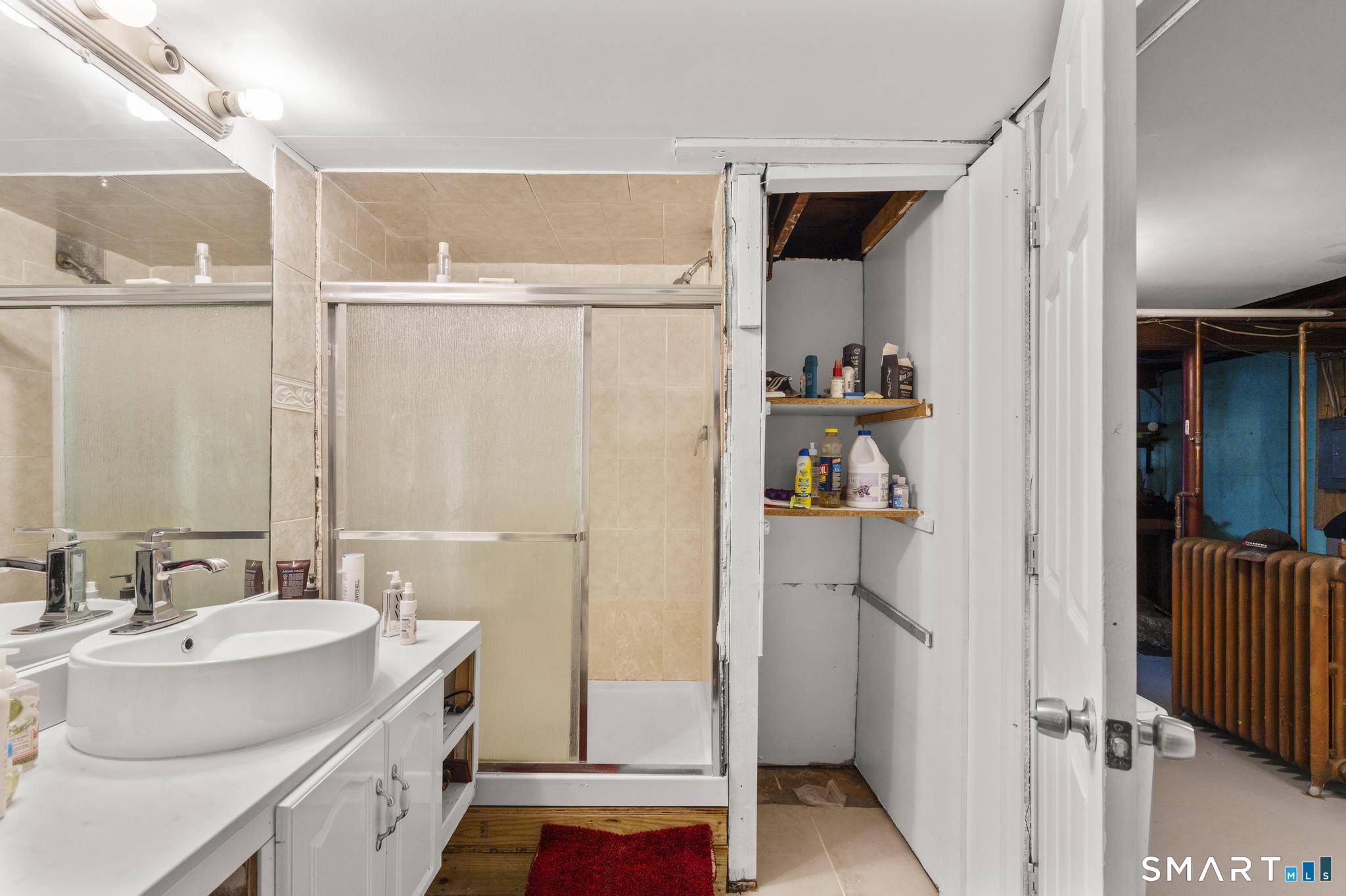 208 Bungay Road Seymour, CT 06483 - Photo 17 of 28 a bathroom with a sink and a mirror
