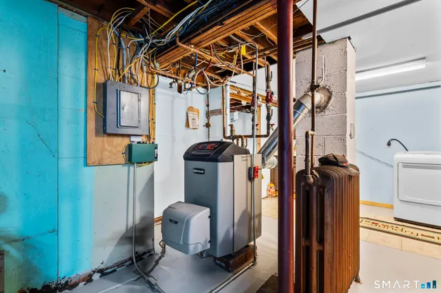 a view of storage and utility room with racks on the wall