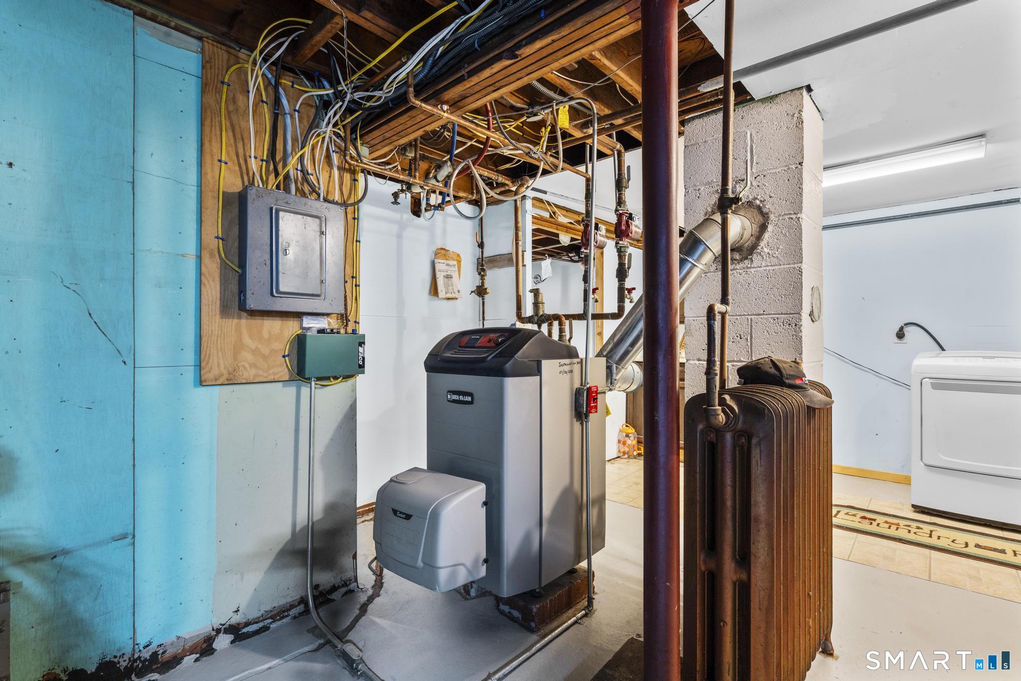 208 Bungay Road Seymour, CT 06483 - Photo 23 of 28 a view of storage and utility room with racks on the wall