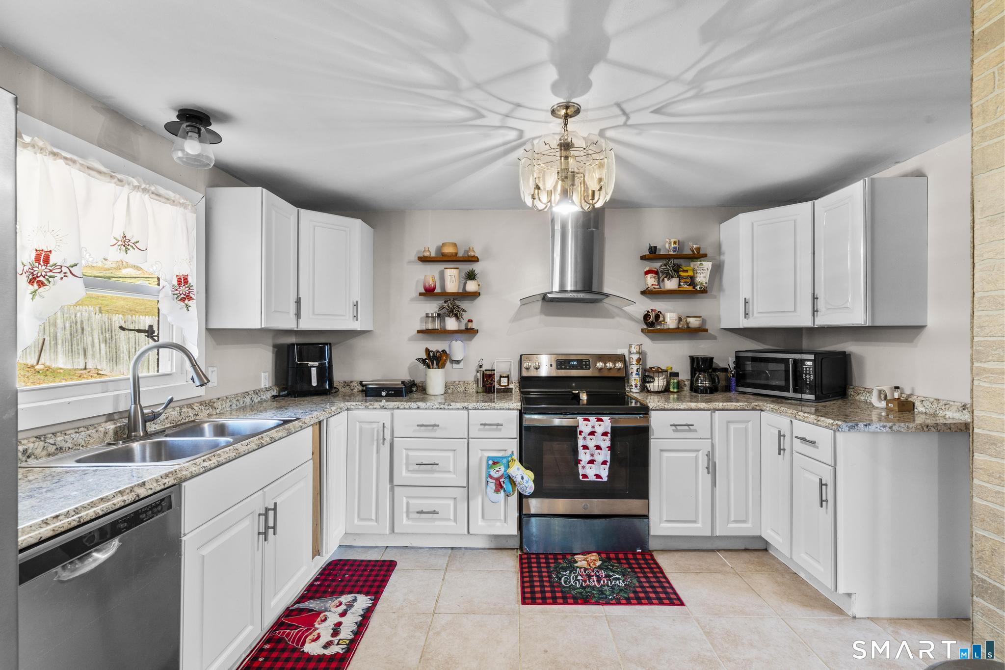 208 Bungay Road Seymour, CT 06483 - Photo 3 of 28 a kitchen with stainless steel appliances granite countertop a sink a stove a refrigerator cabinets and a window