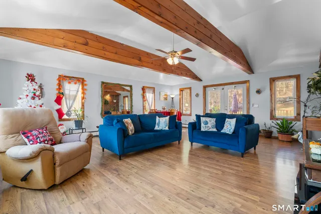 a living room with furniture and a flat screen tv