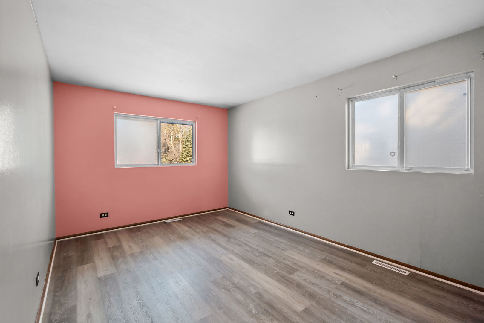 18945 West Old Plank Road Grayslake, IL 60030 - Photo 13 of 21 an empty room with wooden floor and windows