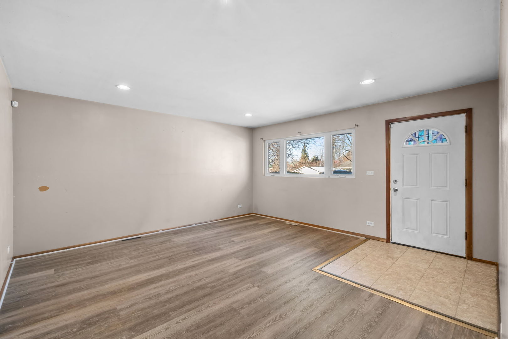 18945 West Old Plank Road Grayslake, IL 60030 - Photo 3 of 21 an empty room with windows