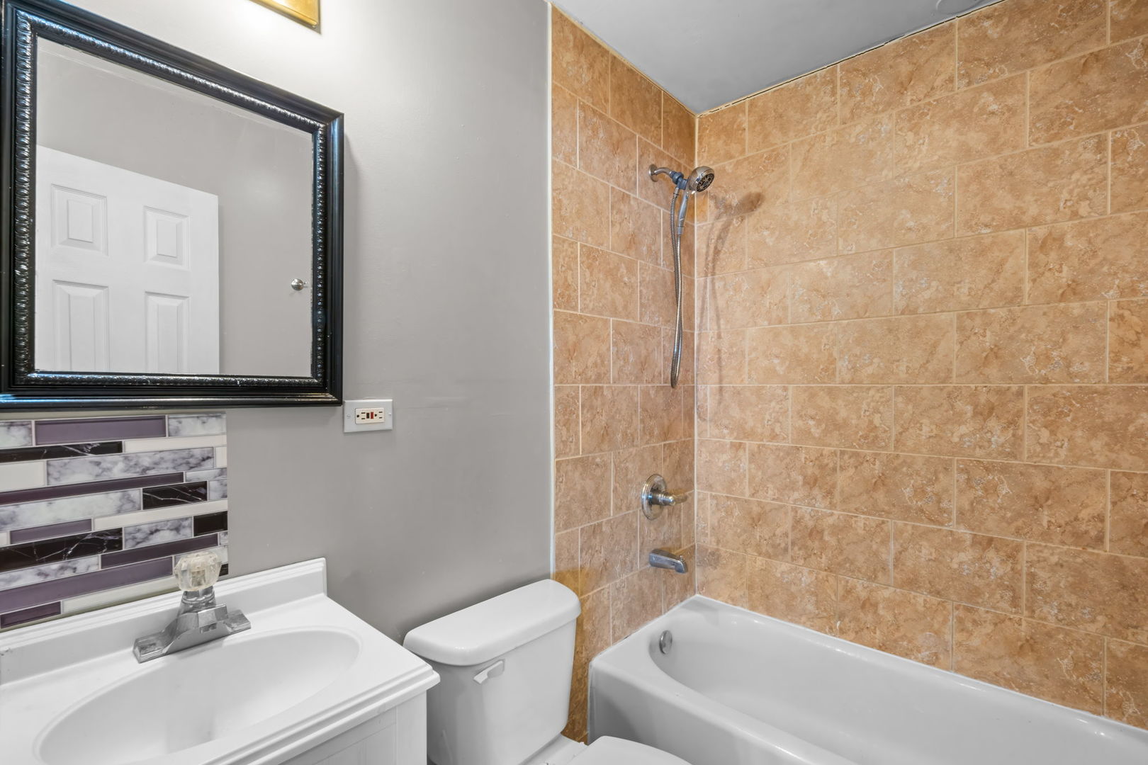18945 West Old Plank Road Grayslake, IL 60030 - Photo 9 of 21 a bathroom with a sink a toilet and a bathtub
