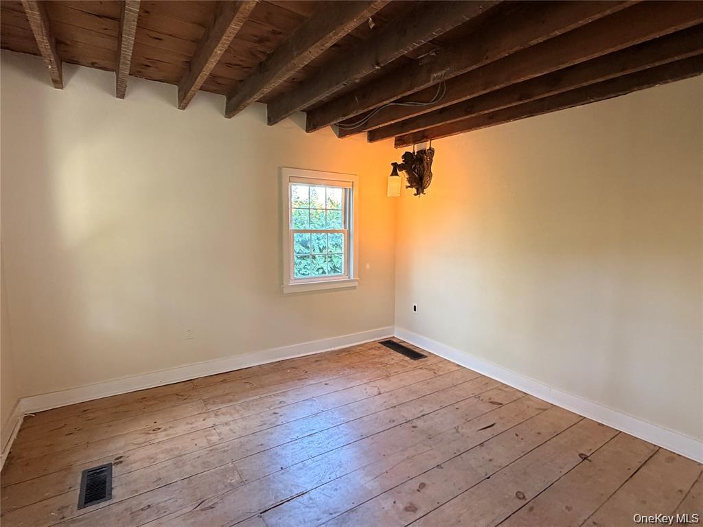 265 Maybrook Road Campbell Hall, NY 10916 - Photo 12 of 20 a view of empty room with wooden floor and fan