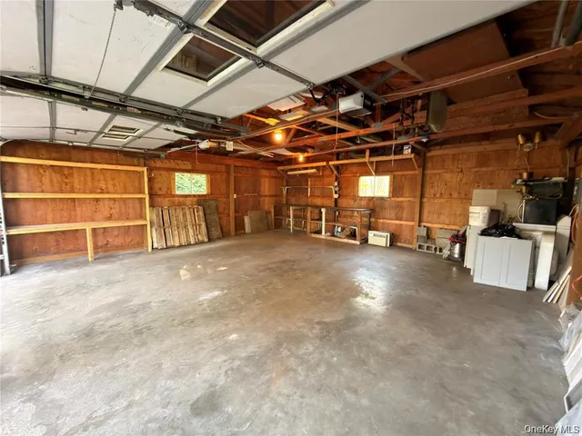 a view of an empty room with storage