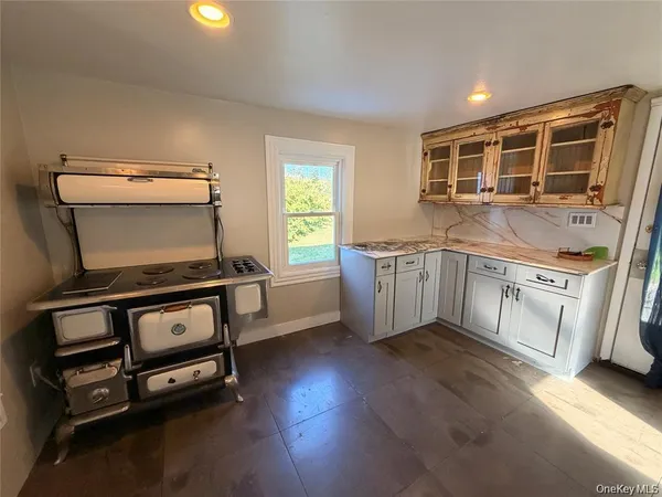 a kitchen with a stove and a microwave