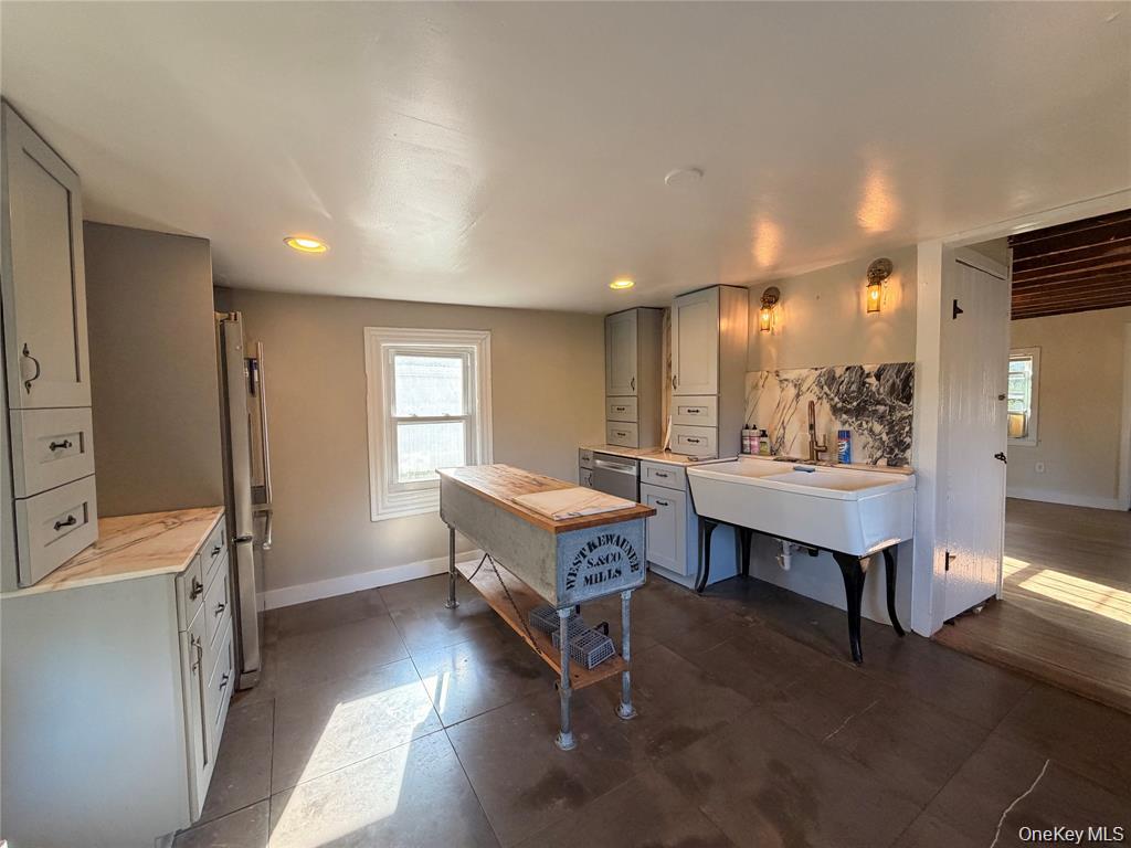 265 Maybrook Road Campbell Hall, NY 10916 - Photo 6 of 20 a living room with furniture a table and kitchen view