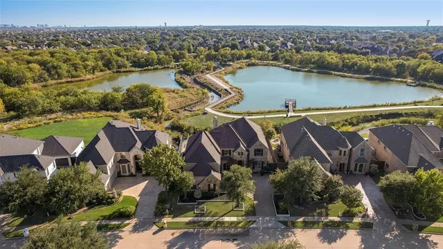 an aerial view of residential house with outdoor space and lake view