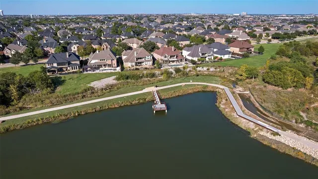 an aerial view of house yard and lake view