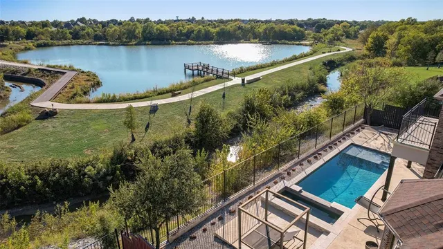 a view of a swimming pool with a lake view