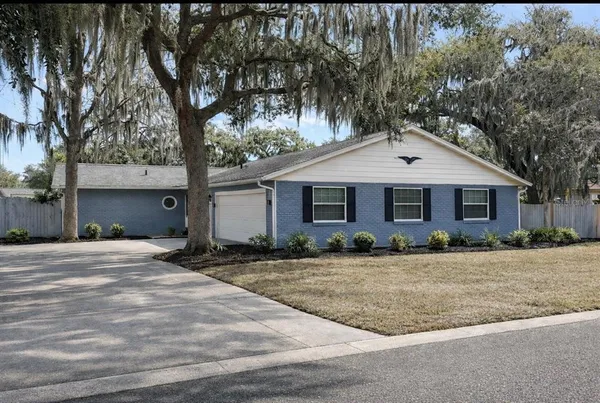 a front view of a house with yard