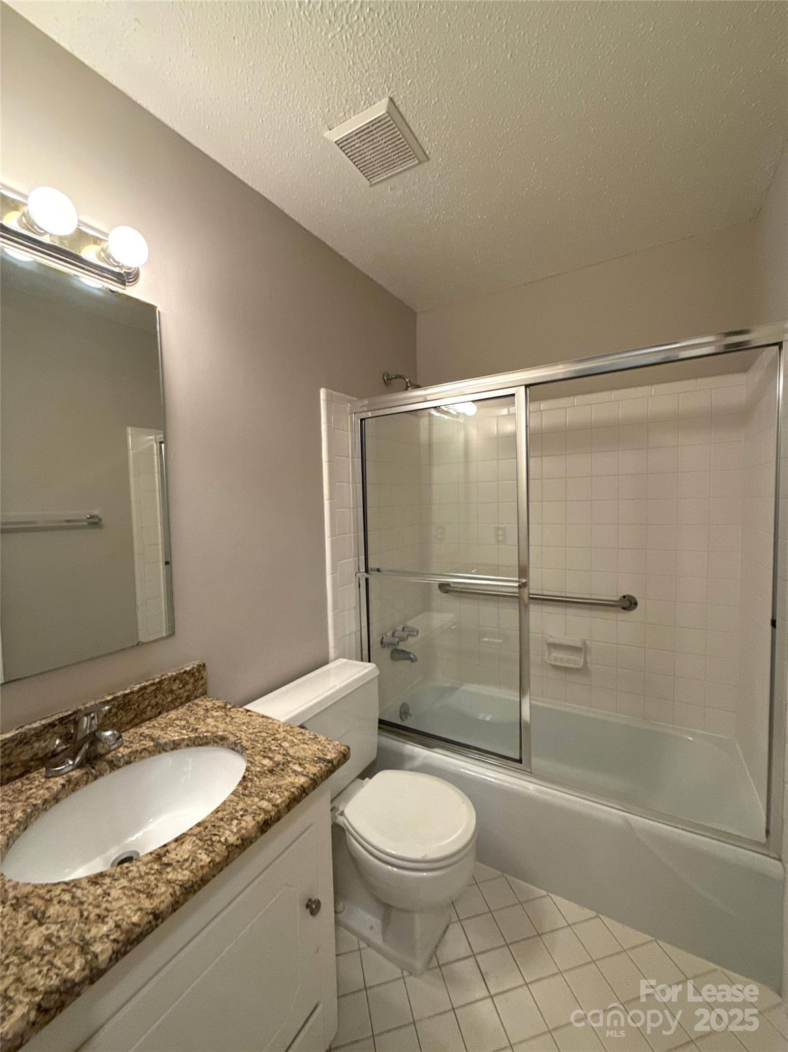 906 McLaughlin Drive Charlotte, NC 28212 - Photo 19 of 21 a bathroom with a granite countertop sink toilet and shower