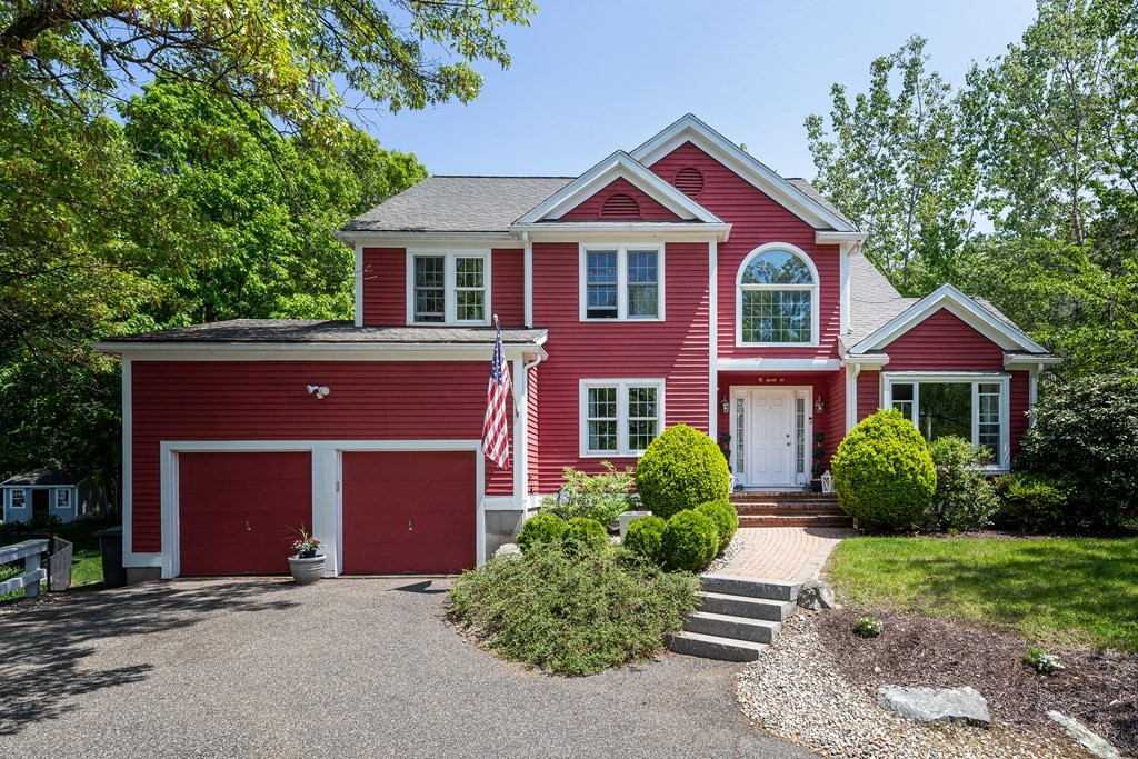 51 Davis Street Northborough, MA 01532 - Photo 1 of 35 a front view of a house with yard and green space