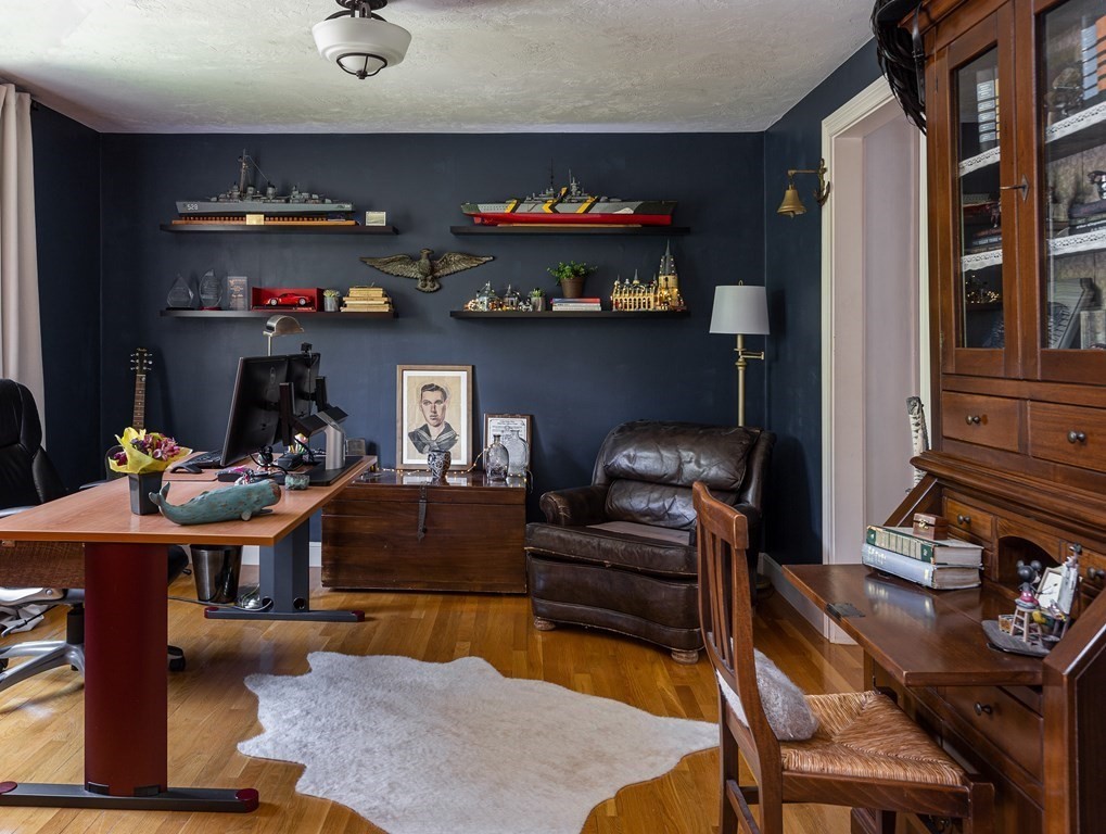 51 Davis Street Northborough, MA 01532 - Photo 11 of 35 a living room with furniture a flat screen tv and kitchen view