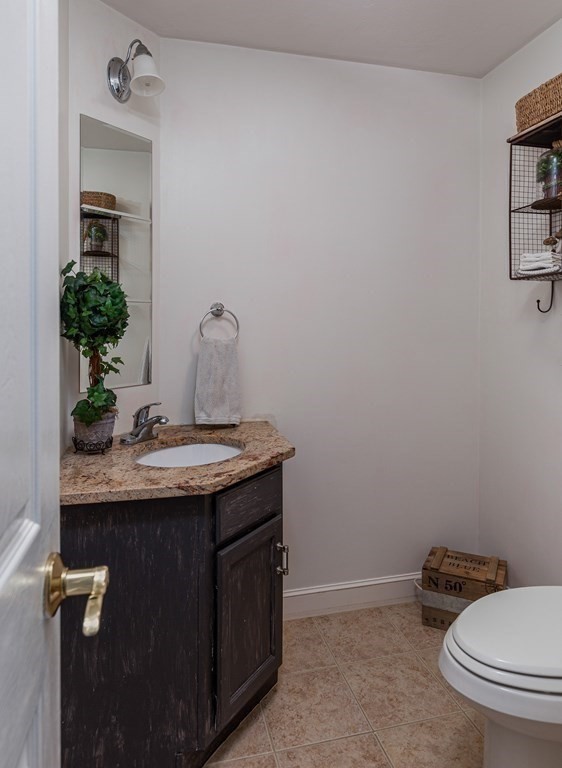 51 Davis Street Northborough, MA 01532 - Photo 13 of 35 a bathroom with a granite countertop sink and a mirror