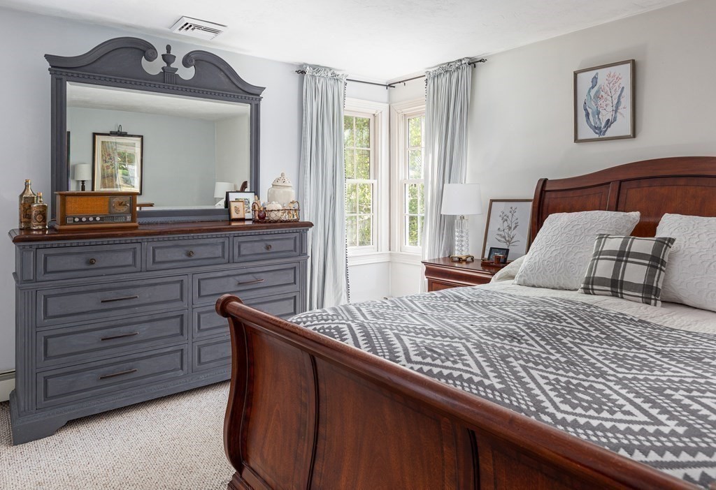 51 Davis Street Northborough, MA 01532 - Photo 16 of 35 a bedroom with a bed and a large mirror on dresser