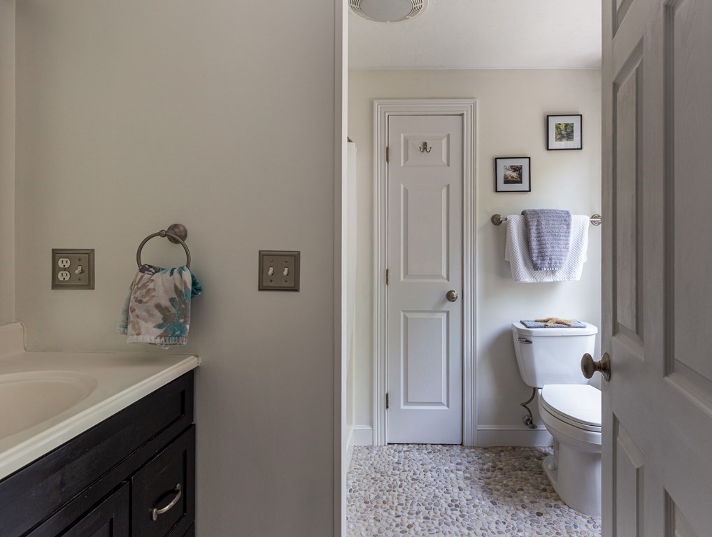 51 Davis Street Northborough, MA 01532 - Photo 17 of 35 a bathroom with a sink a toilet and shower