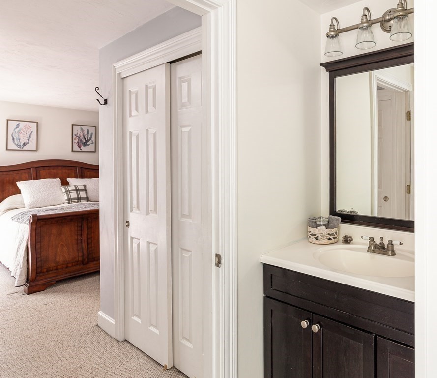 51 Davis Street Northborough, MA 01532 - Photo 18 of 35 a bathroom with a sink and a mirror
