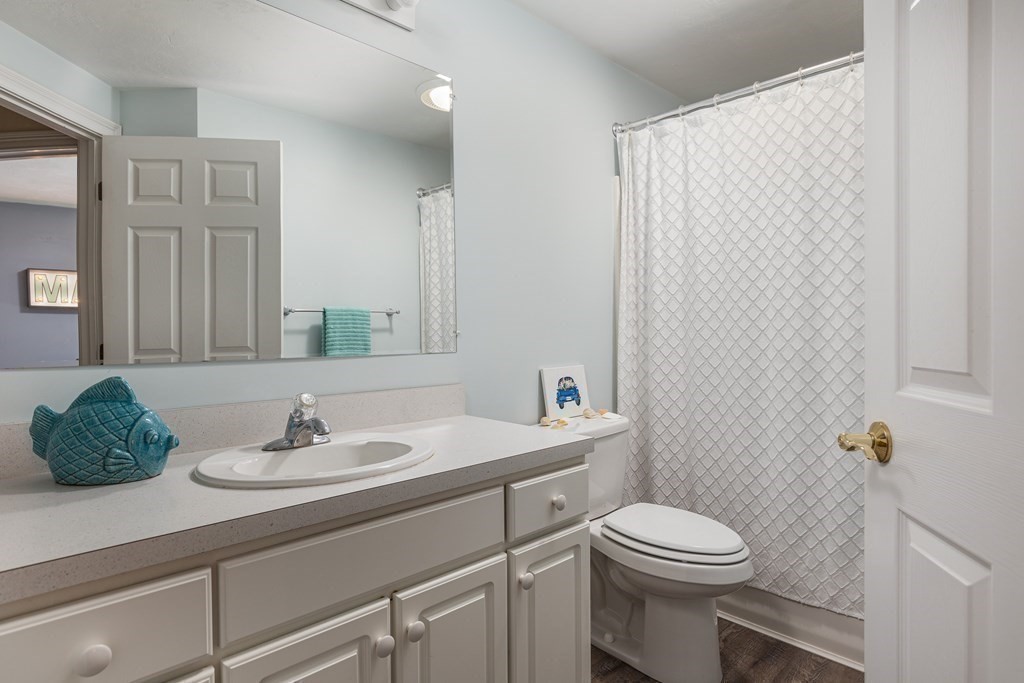 51 Davis Street Northborough, MA 01532 - Photo 20 of 35 a bathroom with a sink a toilet and mirror