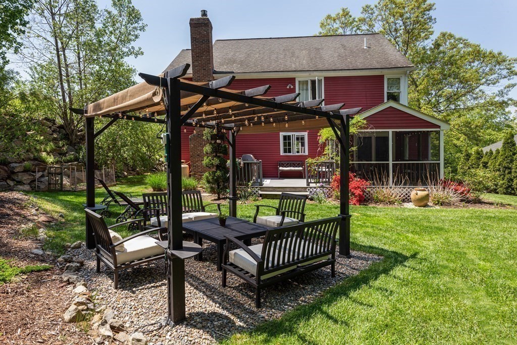 51 Davis Street Northborough, MA 01532 - Photo 29 of 35 a view of a chairs and table in the backyard