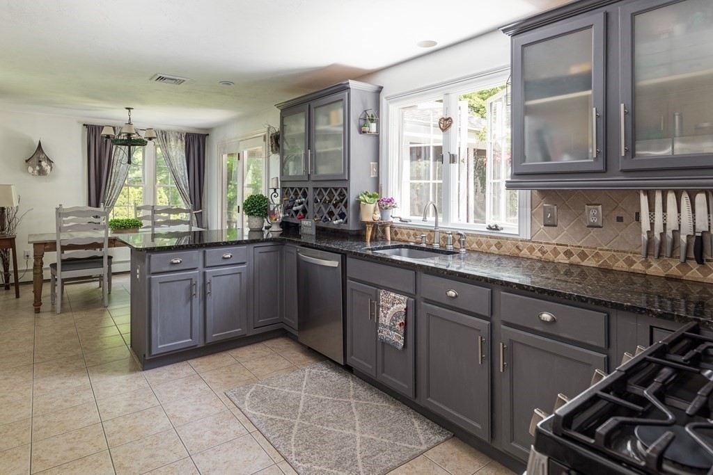51 Davis Street Northborough, MA 01532 - Photo 3 of 35 a kitchen with a sink stove and cabinets