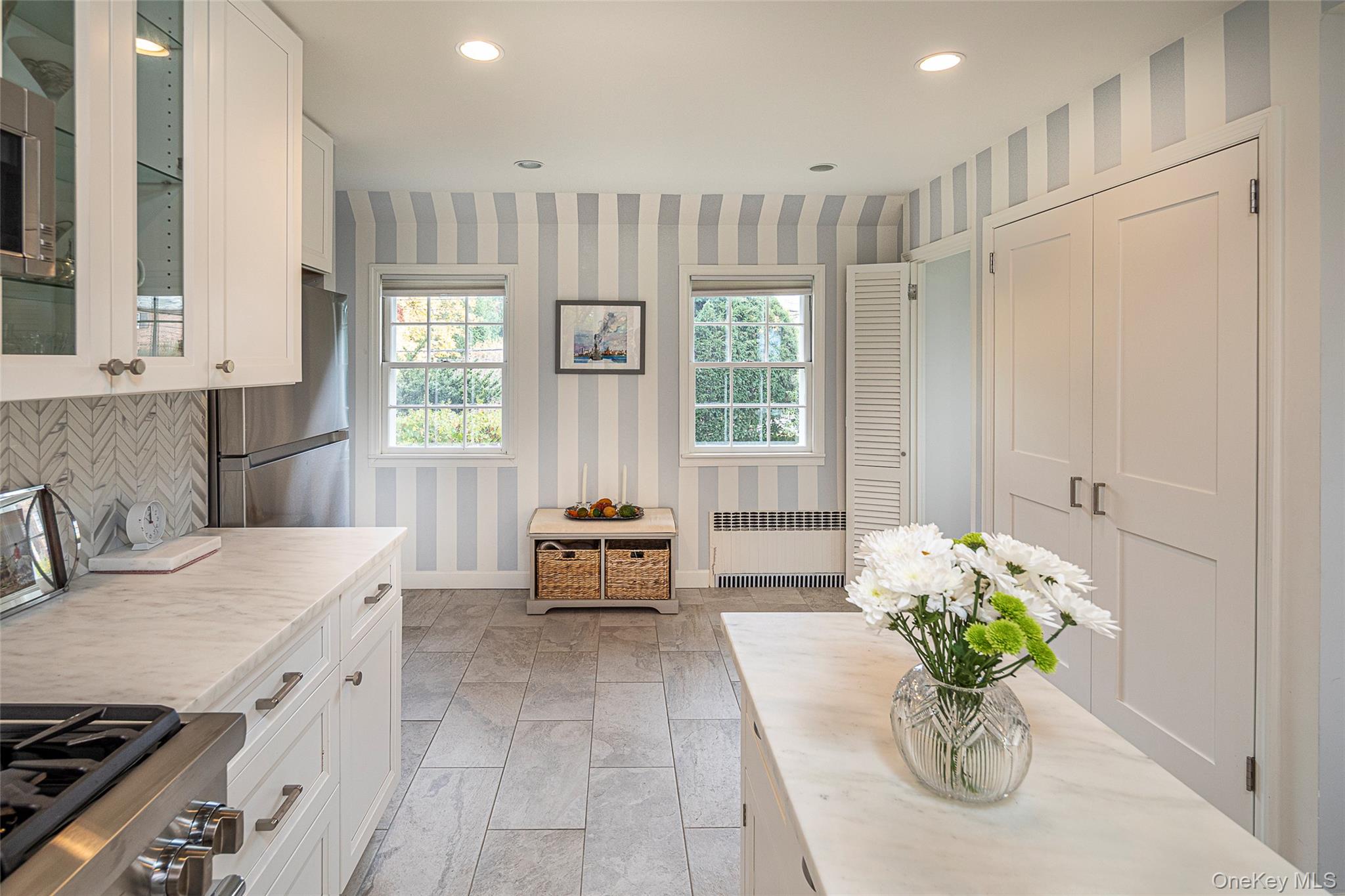 80 Hereford Road Bronxville, NY 10708 - Photo 20 of 36 Kitchen with Danby marble countertops and stainless steel appliances