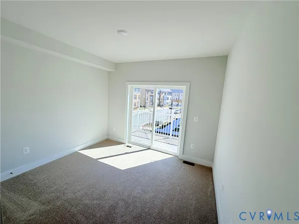 a view of an empty room and window