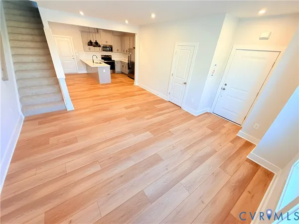 a view of a living room with wooden floor