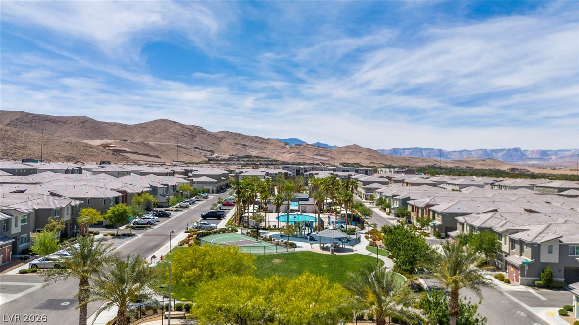 12367 Indigo Montage Road, Unit 3 Las Vegas, NV 89183 - Photo 31 of 33 An aerial perspective reveals a vibrant community nestled among rugged hills, with abundant recreational spaces.