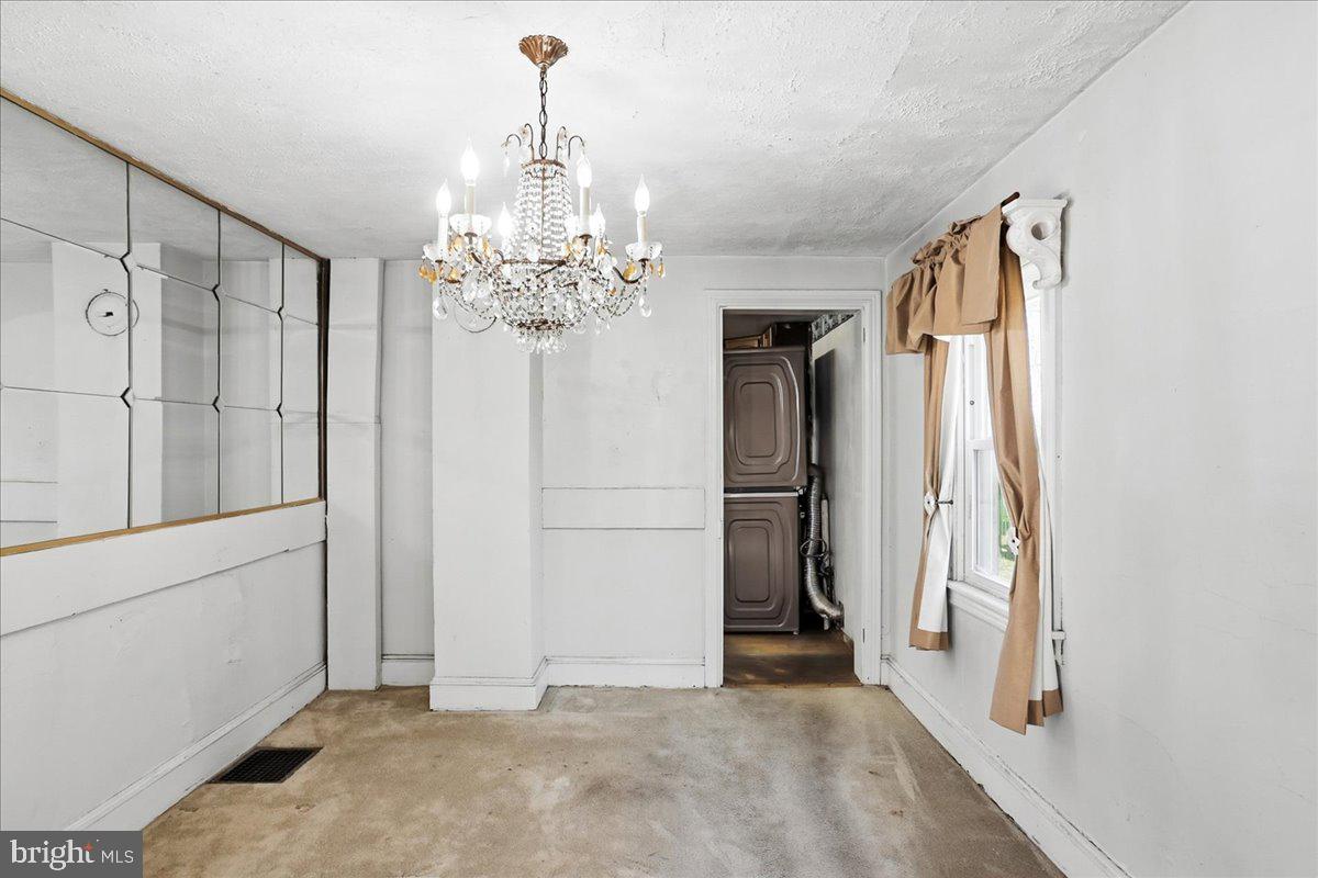 966 Upper Gulph Road Wayne, PA 19087 - Photo 4 of 23 a view of a hallway with closet and chandelier