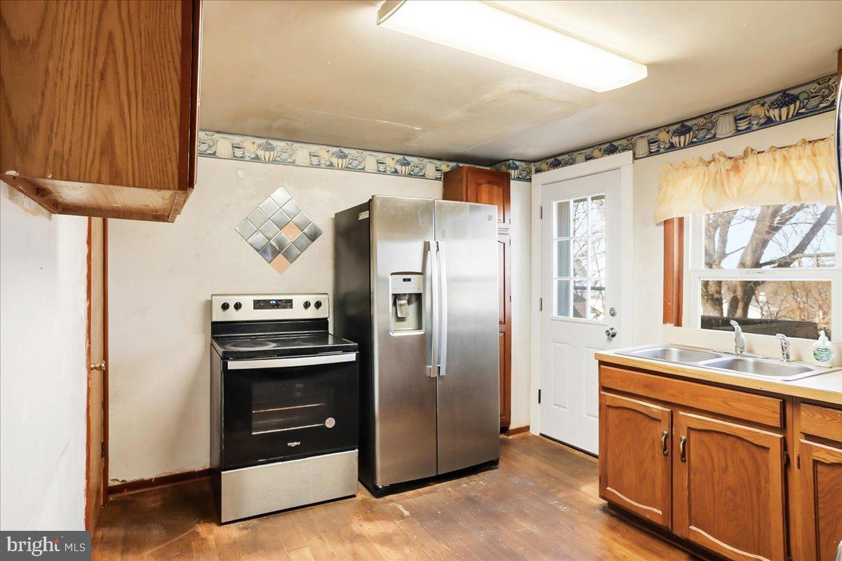 966 Upper Gulph Road Wayne, PA 19087 - Photo 6 of 23 a kitchen with stainless steel appliances a refrigerator and a sink