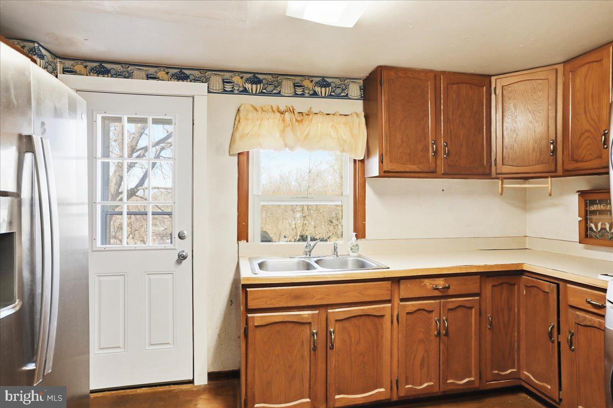 966 Upper Gulph Road Wayne, PA 19087 - Photo 7 of 23 a kitchen with stainless steel appliances granite countertop a refrigerator and a sink