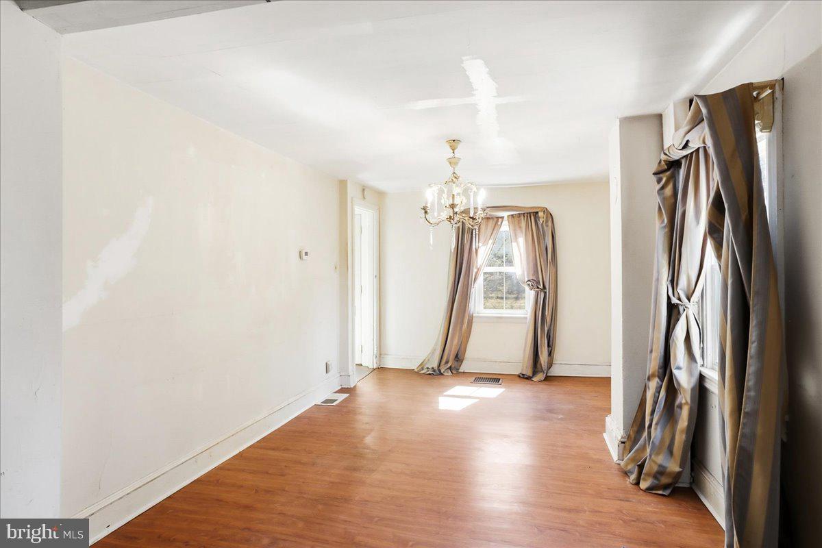 966 Upper Gulph Road Wayne, PA 19087 - Photo 10 of 23 a view of a room with wooden floor and stairs