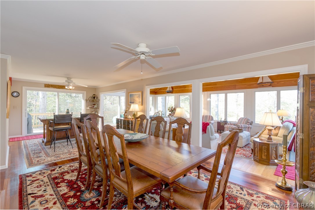 273 Cove Colony Road Lancaster, VA 22503 - Photo 17 of 46 a view of a dining room with furniture window and outside view