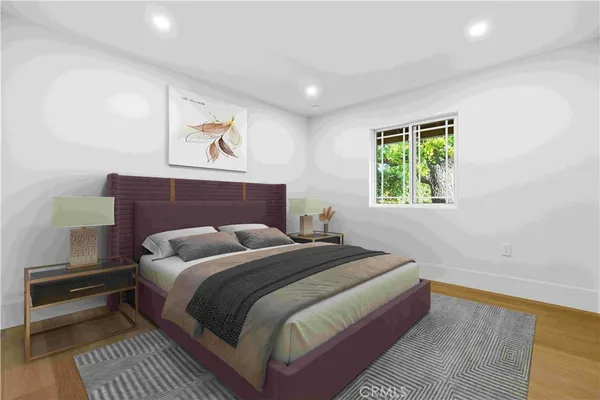 a bedroom with bed and a window