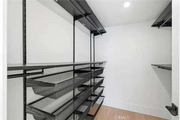 a view of a white house with a swimming pool