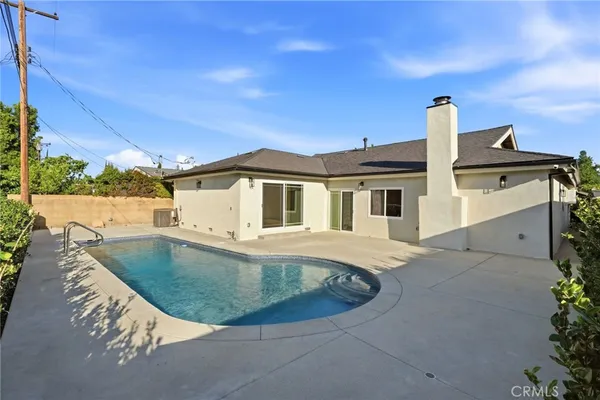 a view of an house with backyard space