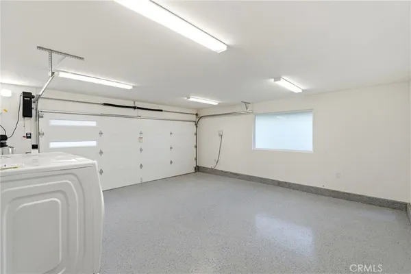 a view of a room with gym equipment and a large window