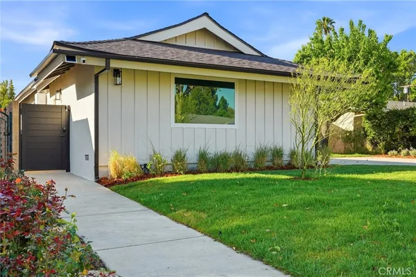 a aerial view of a house with garden space and street view