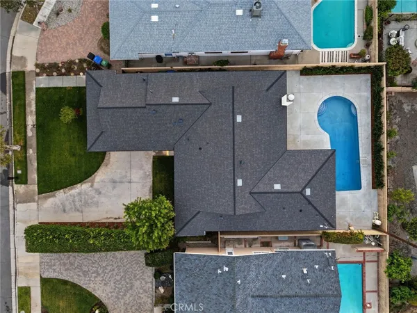 an aerial view of a house with a garden