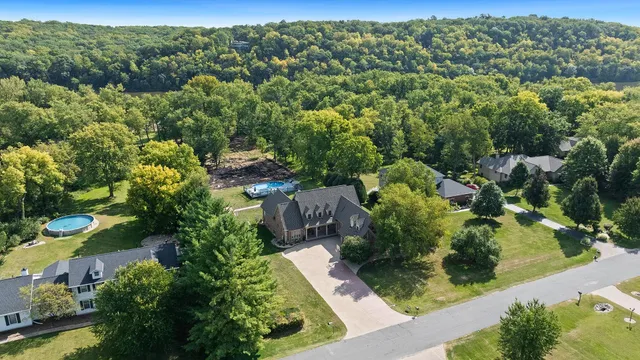 an aerial view of a forest with houses