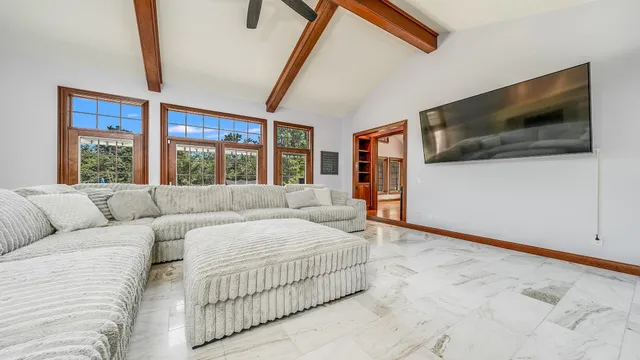 a view of a dining room with furniture wooden floor and chandelier