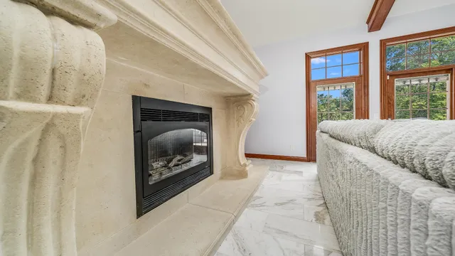 a view of a livingroom with furniture wooden floor and chandelier