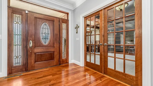 a view of entryway with wooden floor