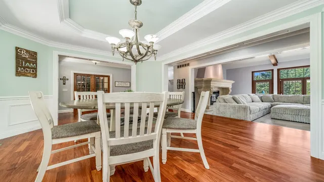 a kitchen with stainless steel appliances granite countertop a kitchen island a stove and a refrigerator