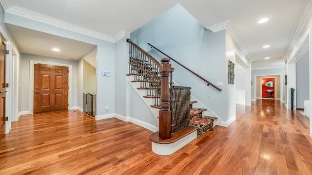 a kitchen view with stainless steel appliances kitchen island a large counter top and oven