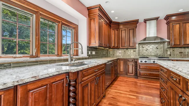 a bathroom with a sink mirror and toilet